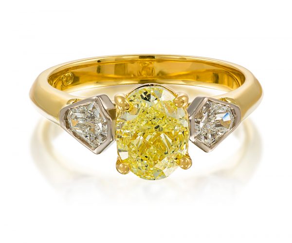 Oval Fancy Yellow Diamond Ring with Two Kite Shaped Diamonds