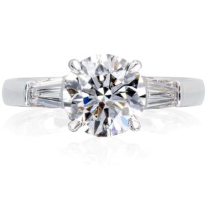 Classic style solitaire diamond ring with tapered baguette shoulder