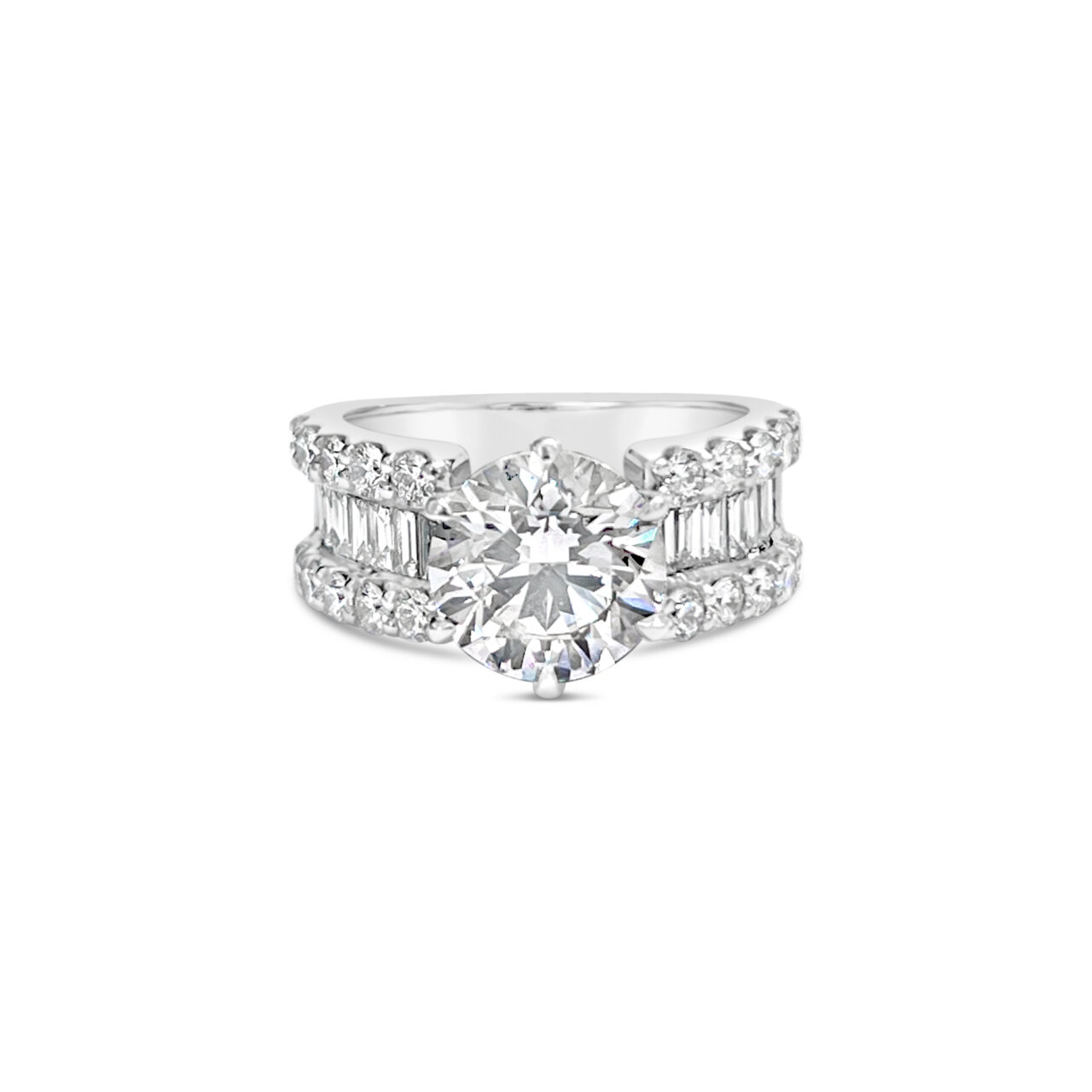 Round diamond and baguette engagement ring